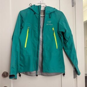 Arc'teryx Turquoise Jacket with Neon Yellow Zippers